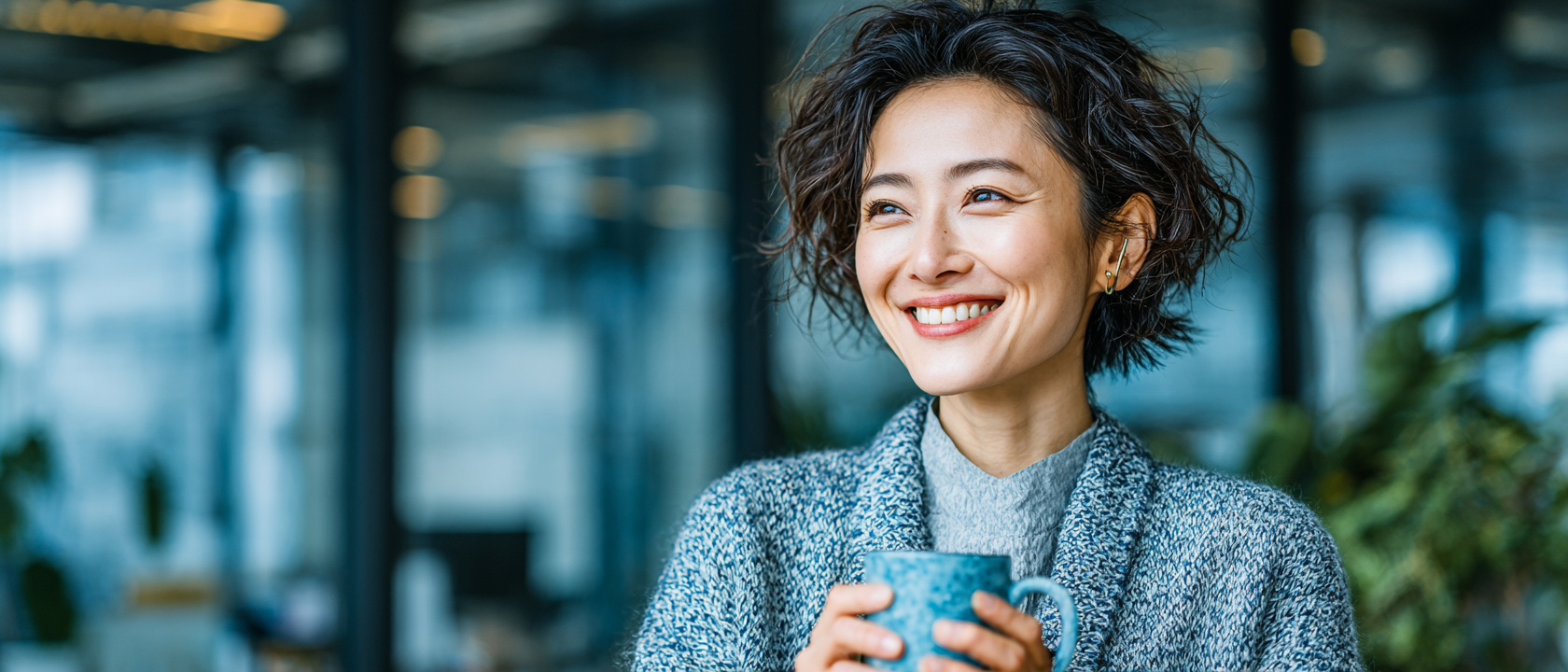 A leader mid-laugh in a light-filled office